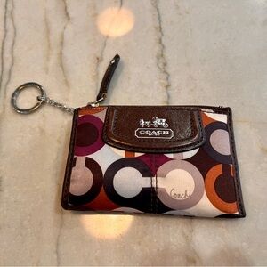 Coach Madison Maggie Keychain Coin Purse in great condition. Rare purple/orange